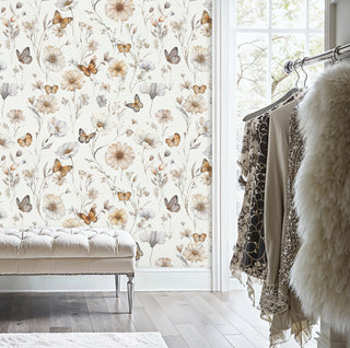 Cream butterfly wallpaper featuring scattered wildflowers, displayed in dressing room with tufted bench