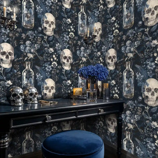 Dark botanical wall mural featuring skulls and blue flowers, displayed in sophisticated vanity area with brass fixtures