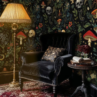 dark botanical wallpaper featuring skulls and mushrooms in cozy reading corner with leather chair