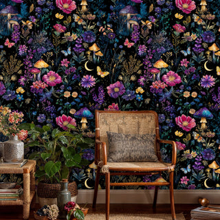 Dark botanical wallpaper showcasing purple and pink blooms, featured in boho living room with rattan chair