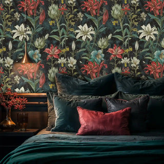 Dark botanical wallpaper with coral lilies and white blooms in luxurious bedroom with emerald bedding