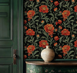 Dark botanical wallpaper with coral peonies and sage foliage, shown in entryway with antique console table