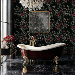 Dark botanical wallpaper with crimson flowers displayed in luxury bathroom with clawfoot bathtub