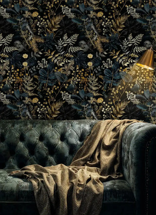 Dark botanical wallpaper with gold ferns and berries in luxurious living room with tufted velvet sofa