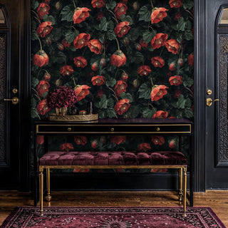Dark botanical wallpaper with hellebore pattern displayed in elegant entryway with velvet bench and gold accents