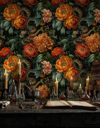 Dark botanical wallpaper with orange peonies and serpents on alchemist's table with candles and bottles