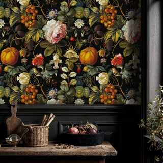 Dark floral wallpaper featuring botanical harvest elements in elegant kitchen with wooden cutting board and fruit bowl