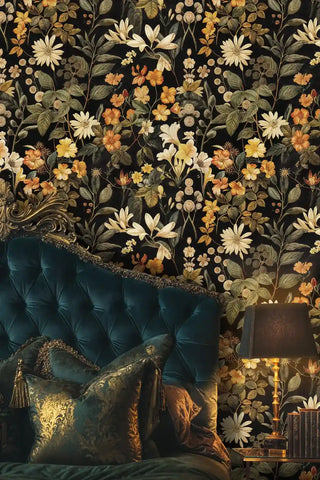 Dark floral wallpaper featuring cream and orange botanicals, displayed in elegant bedroom with tufted velvet headboard