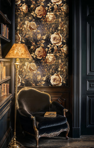 Dark floral wallpaper, gold roses on black, in a library with an armchair and floor lamp