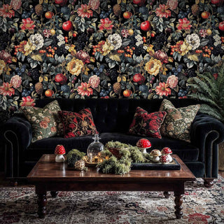 Dark floral wallpaper with mixed fruits and flowers shown in cozy living room with decorative mushroom centerpiece
