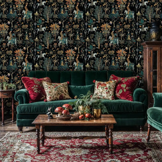 Dark folk tale wallpaper with golden stars and forest motifs, displayed in traditional living room with green velvet sofa
