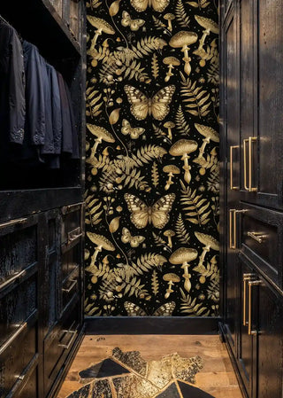 Dark forest wallpaper with golden ferns and butterflies, styled in luxury walk-in closet