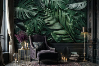 Dark jungle leaf wall mural with botanical details, displayed in sophisticated reading room with velvet armchair
