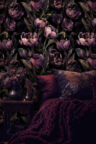 Dark moody tulip wallpaper with purple blooms and golden leaves in luxury bedroom with matching purple bedding