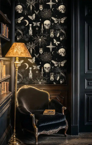 Dark mystical wallpaper featuring skulls and butterflies in elegant library with gold-framed chair