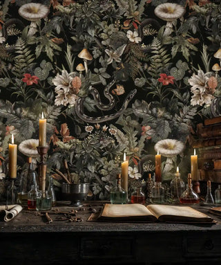 Dark nature wallpaper featuring mystical forest elements in atmospheric room with candles and glass bottles
