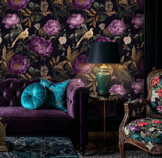 Dark purple floral wallpaper with golden birds featured in moody bedroom with sequined pillows