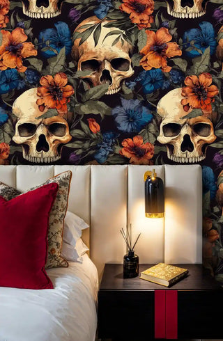 Dark skull and flower wallpaper in dramatic bedroom setting with modern sconce lighting