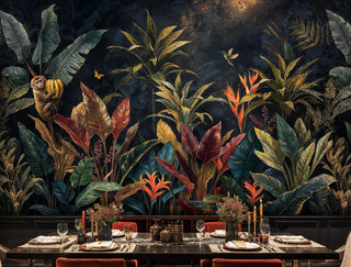 Dark tropical foliage wall mural with monkey and birds of paradise in a dramatic dining room with candlelit table setting