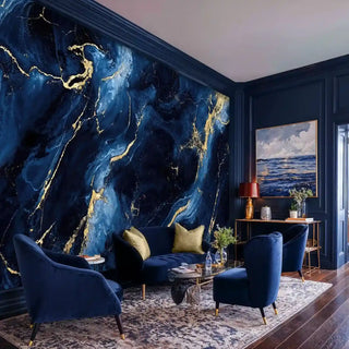Deep blue marble wallpaper with golden veins in cozy sitting area with velvet armchairs