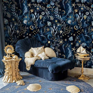 Deep sea wallpaper with starfish, coral and celestial dots, shown in elegant sitting area with velvet chair