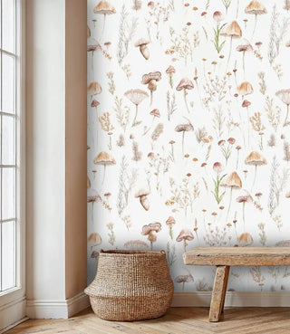 Delicate woodland wallpaper showing mushrooms and botanicals, featured in bright room with wicker basket