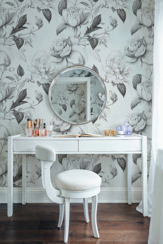 Detailed floral wall mural with monochrome roses, showcased in elegant vanity area with round mirror