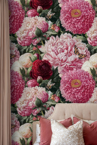 Detailed floral wallpaper with butterflies and blooms in cozy bedroom corner with beige upholstered bed