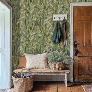 Detailed view of a botanical wallpaper with reed motifs, green-gold painterly, by coat hooks