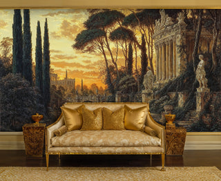 Detailed view of a classical garden ruins wall mural with cypress trees, statues and golden sky, behind a gold sofa