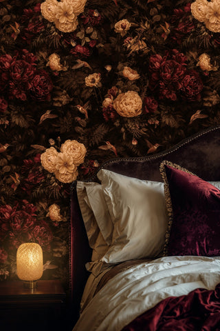 Detailed view of a floral hummingbird Wallpaper with beige blooms and burgundy botanicals in a bedroom with bedside lamp