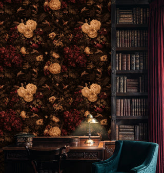Detailed view of a floral hummingbird Wallpaper with dark leaves and beige flowers in a study with bookcase and desk lamp