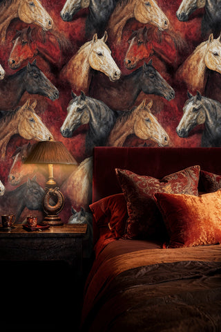 Detailed view of a Horse Wallpaper with painterly horse portraits in red, brown and black, in a bedroom with lamp