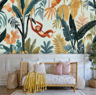 Detailed view of a jungle monkey wall mural, teal and gold leaves, rattan daybed