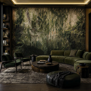 Detailed view of a moss cliff Wall Mural with trailing vines and stone textures in green and beige, with curved sofa
