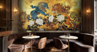 Detailed view of a mythic lions wall mural, gold and blue, with a banquette and tables.