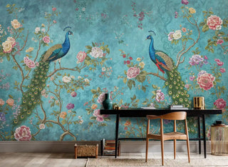 Detailed view of a peacock chinoiserie wall mural with florals, teal and green, shown with a black desk