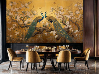 Detailed view of a peacock mural in gold and teal with round table and velvet chairs