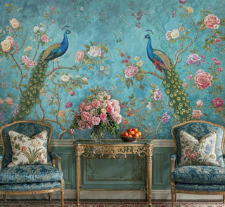 Detailed view of a peacock wall mural, teal and green florals, shown with gilt console and chairs