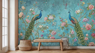 Detailed view of a peacock wall mural with florals, teal and green, shown with a rustic bench