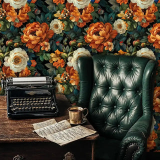 Detailed view of a peony wallpaper in orange and ivory, with leather chair and typewriter