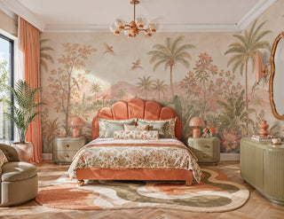 Detailed view of a tropical garden Wall Mural with birds, palms and pink blooms, blush and green, in a bedroom with scallop headboard