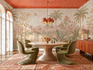 Detailed view of a tropical landscape Wall Mural with palms, lake and pavilion, blush and green, in a dining room with tulip table