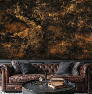 Detailed view of an abstract texture Wall Mural in black and brown, shown above a leather Chesterfield sofa and round table.