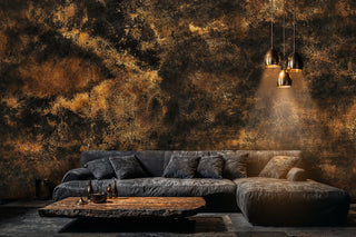Detailed view of an abstract texture Wall Mural in black and brown, shown behind a gray sectional and slab coffee table.