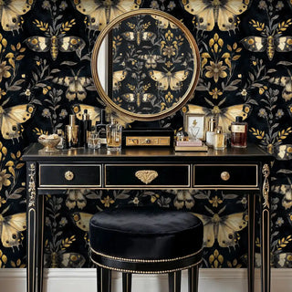 Detailed view of black-gold moth wallpaper, shown with a round mirror and vanity
