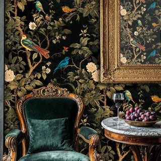 Detailed view of chinoiserie wallpaper, black and green, shown with velvet chair and grapes