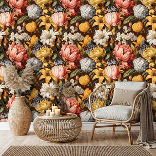 Detailed view of dark floral Wallpaper with yellow and ivory blooms, with rattan chair and candles