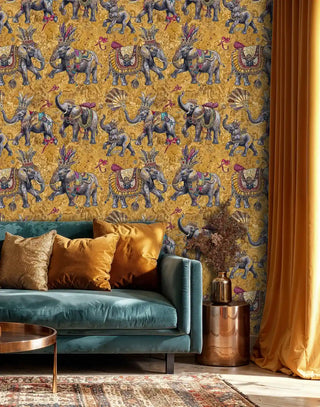 Detailed view of elephant wallpaper, grey on gold, shown with teal sofa and copper table