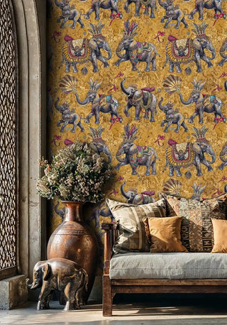 Detailed view of elephant wallpaper, jeweled grey on gold, shown with large terracotta vase
